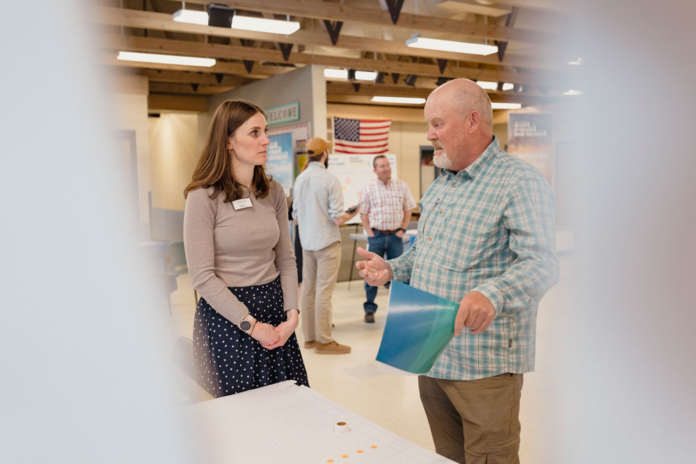 People talking at a Water Planning Open House.